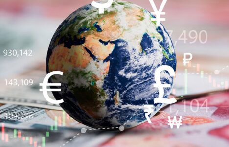 foreign currencies appear around a globe