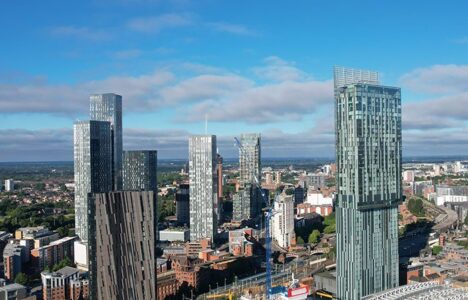 Manchester aerial view showing tall, modern buildings and blue sky