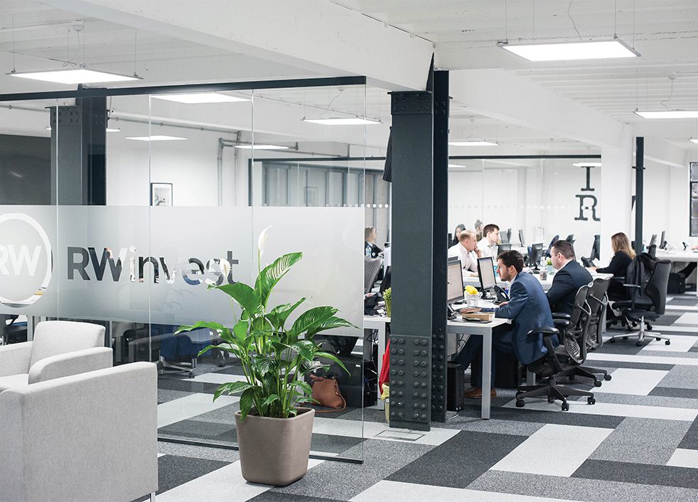 Interior of RWinvest Liverpool office with employees working at desks