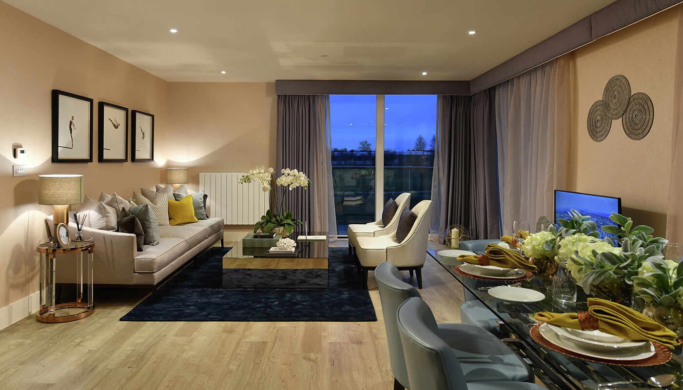 Living room interior in Centrum Court, a property in London, showing furnishings and floor to ceiling window