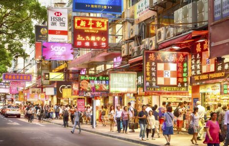 HONG KONG - JUN 19: Neon lights on Tsim Sha Tsui street on June, 19, 2015. Tsim Sha Tsui street is a very popular shopping place in Hong Kong.