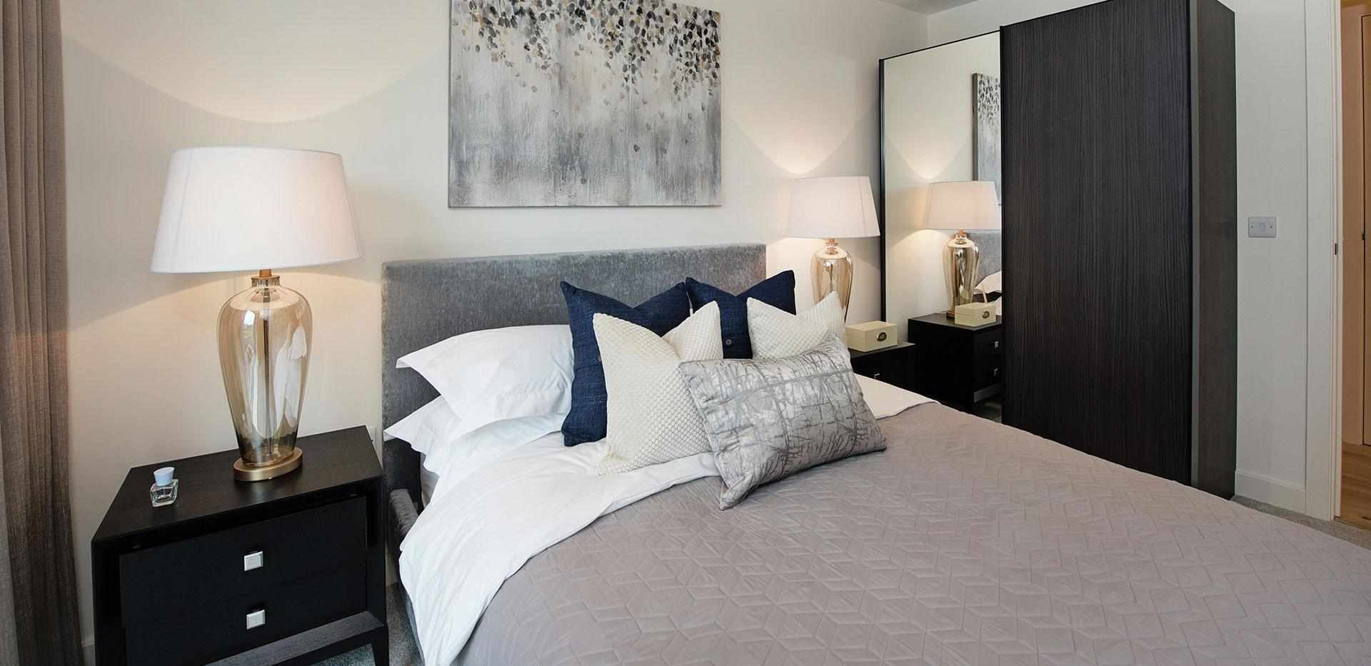 Bedroom interior in West Quay Royal Arsenal in London showing bed and stylish furnishings