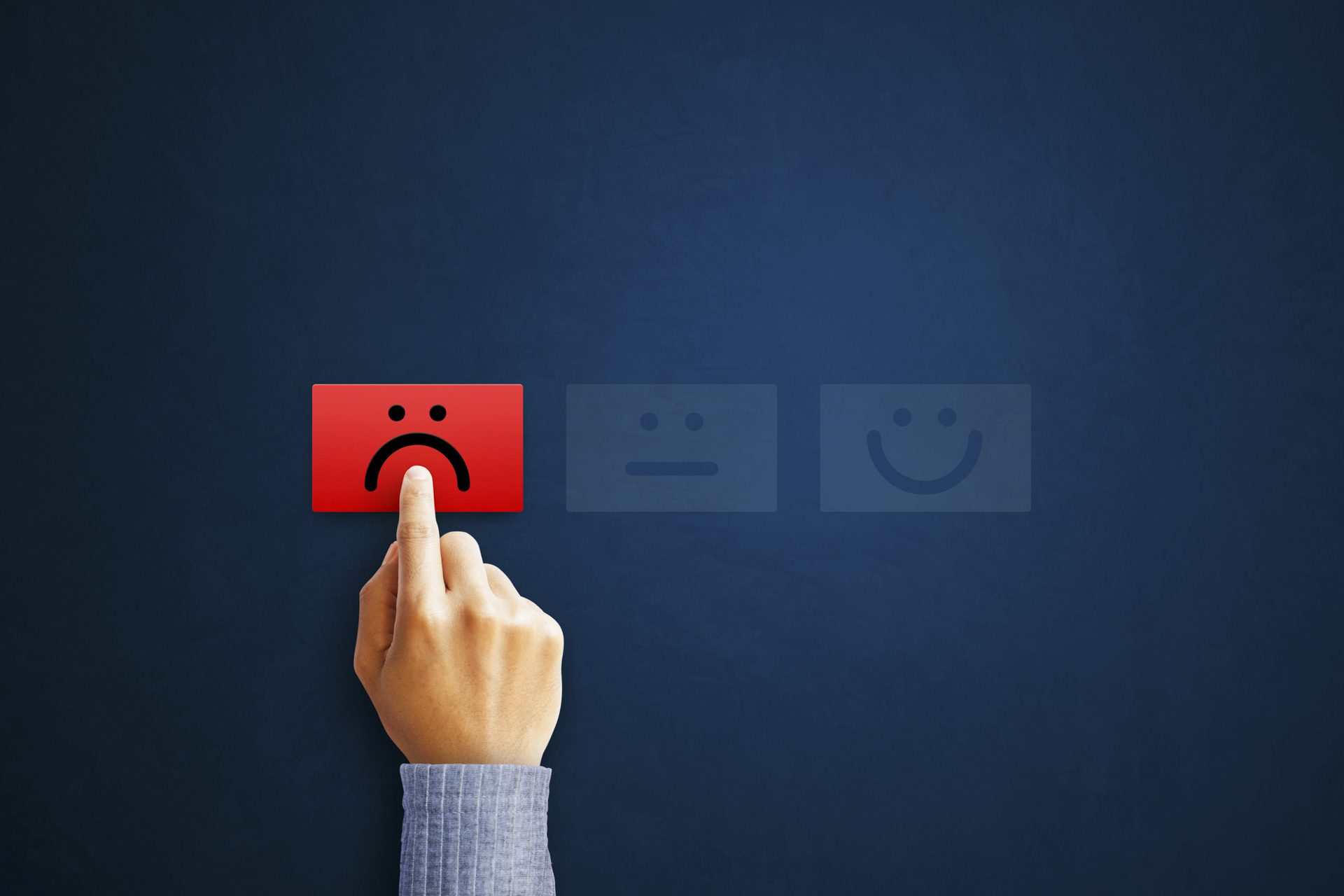 Hand of client show a feedback with bad smile face card. Service rating, satisfaction concept