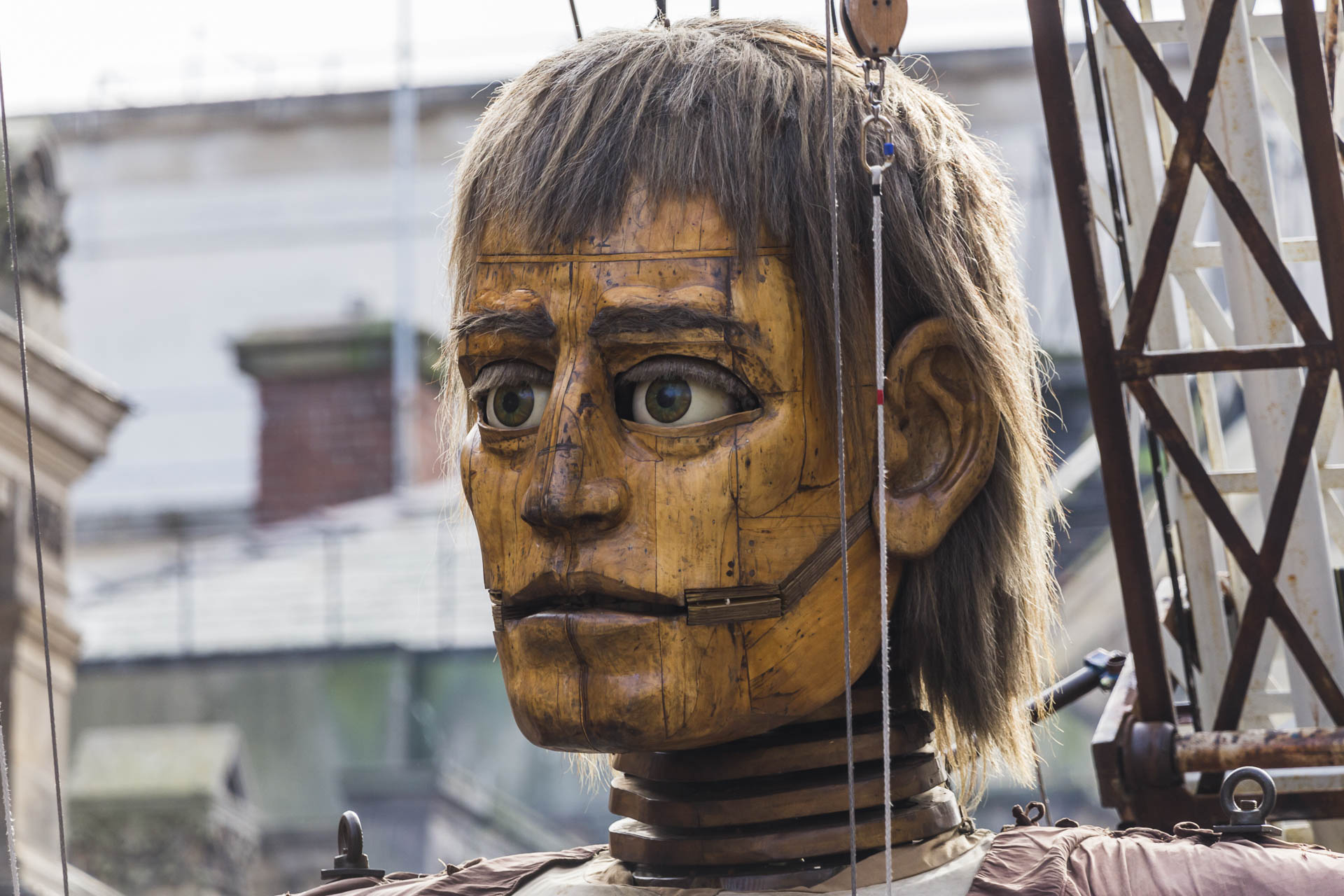 Giant man backlit by the sunshine in Liverpool.