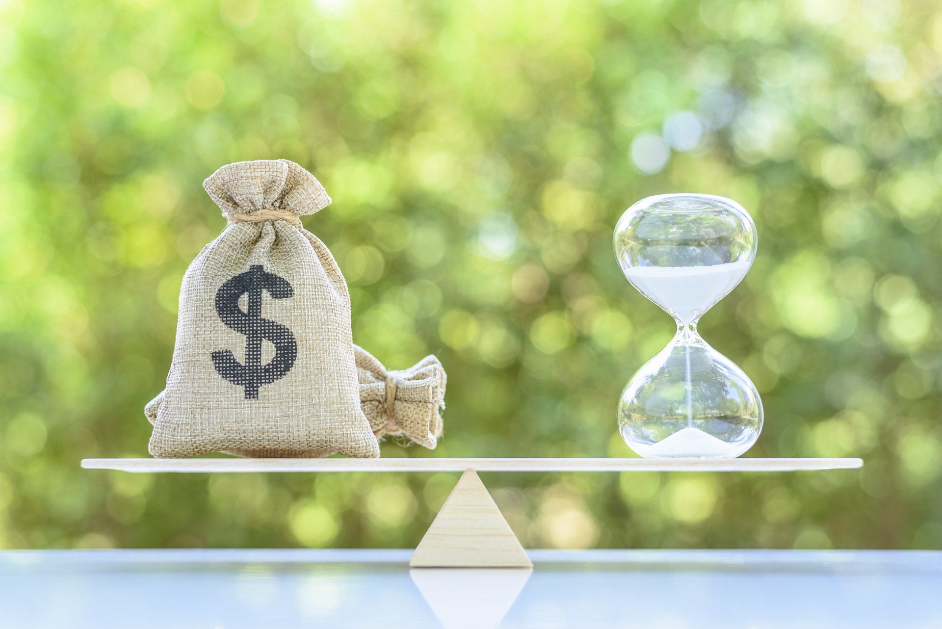 A bag of money balancing