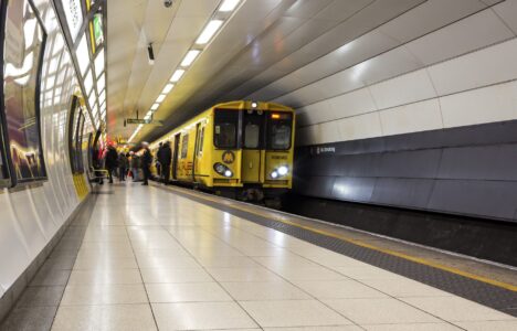 Liverpool / UK - February 22 2020: Passengers moving in a blur on and off Merseyrail British Rail Class 507 train, Moorfields station, Liverpool