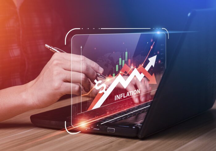 Businessman analyzes and graphs the inflation rate rising on virtual display. financial crisis, tax, cash flow, the concept of higher price inflation and more expensive food. business planning