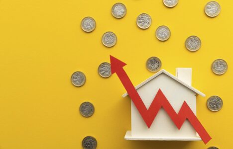 Upward graph over house and pound coins representing increased tenant demand in UK housing market