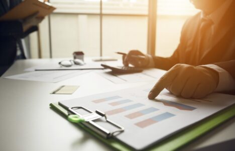 Hand pointing at a document