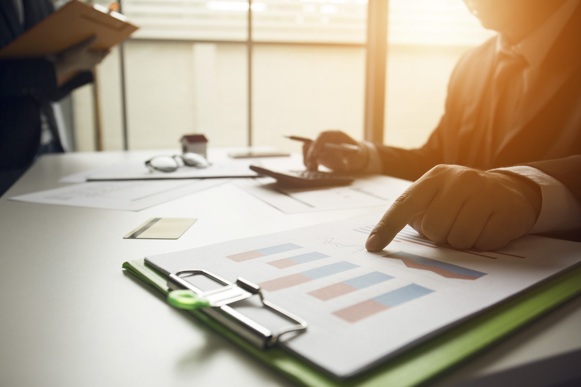 Hand pointing at a document