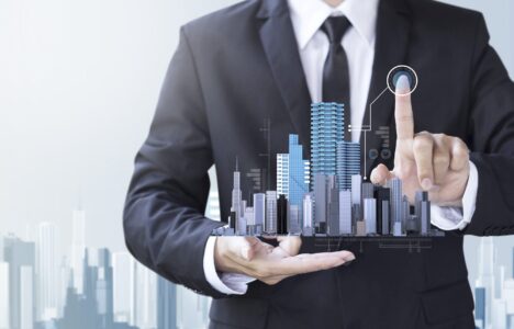 Business man holding property hologram