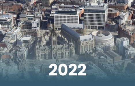 2022 text over city aerial view