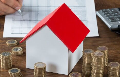 Coins-stack-around-a-house-model