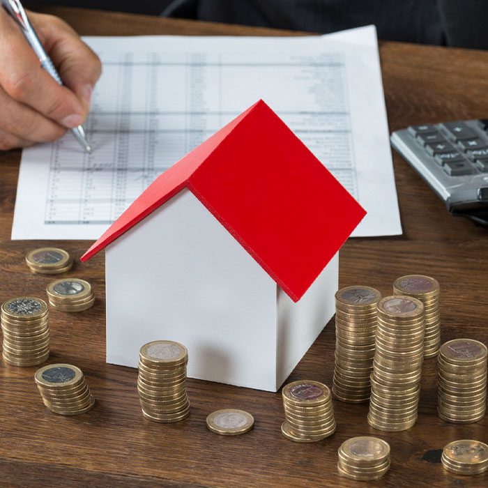 Coins-stack-around-a-house-model