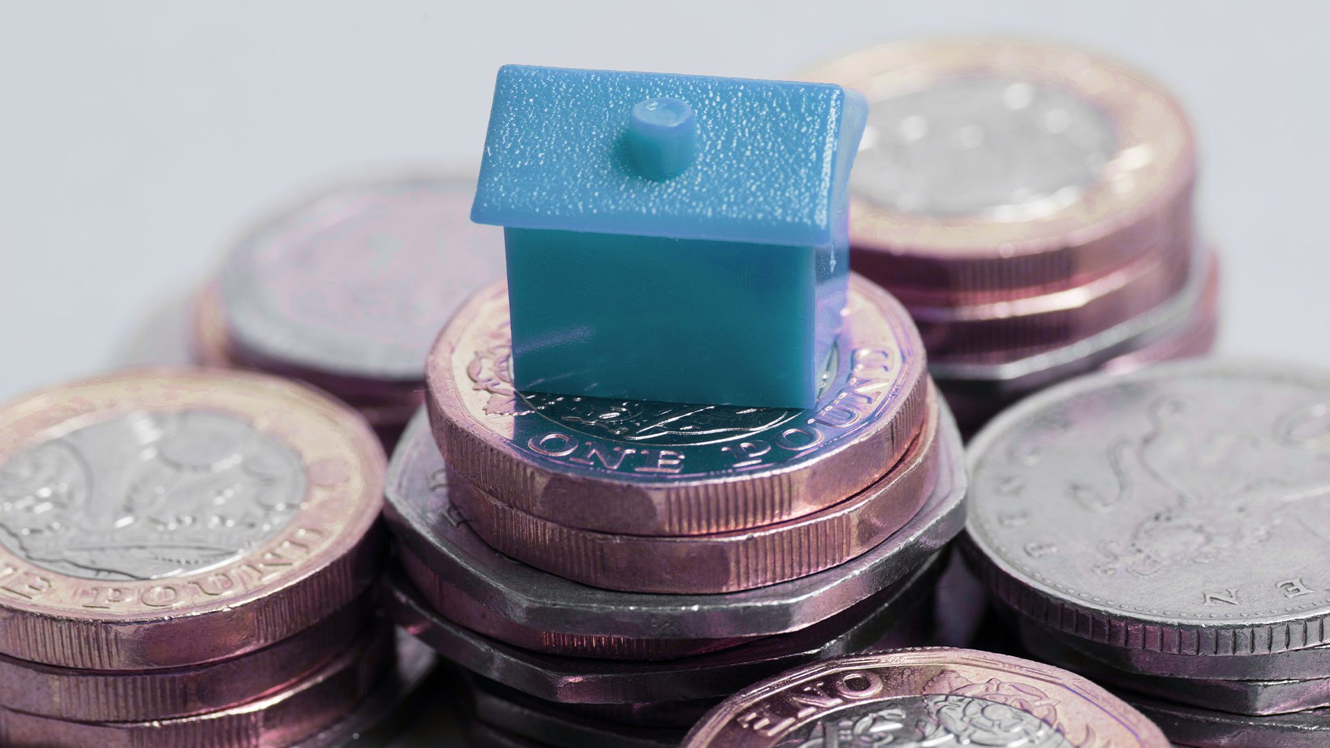 house model on piles of coin