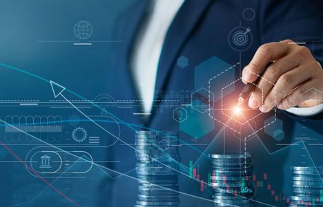 Man pointing at hologram behind piles of coin