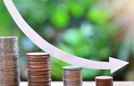 Arrow goes down through piles of coin