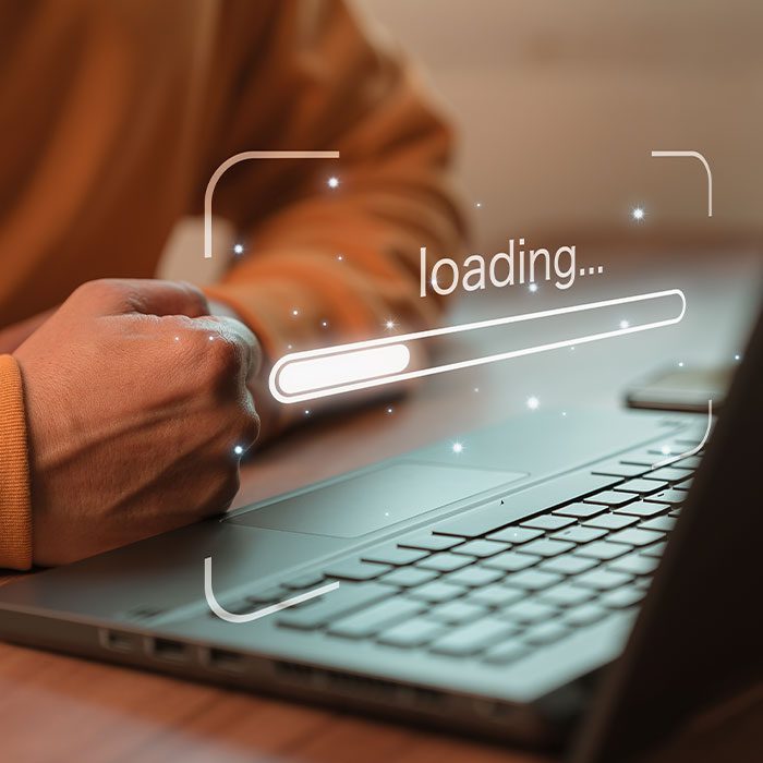 A person waiting for the laptop to load