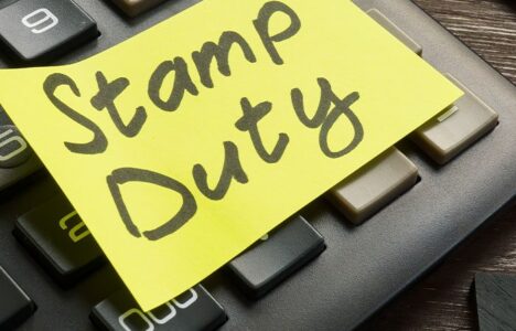 Stamp Duty sticky note on a key borad
