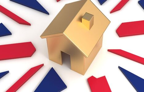 Golden house on Union Jack representing UK property market