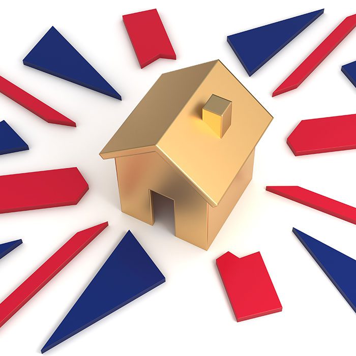 Golden house on Union Jack representing UK property market