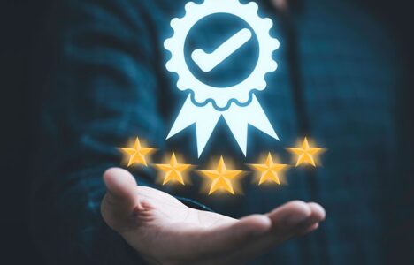 Hand holding an award icon hologram