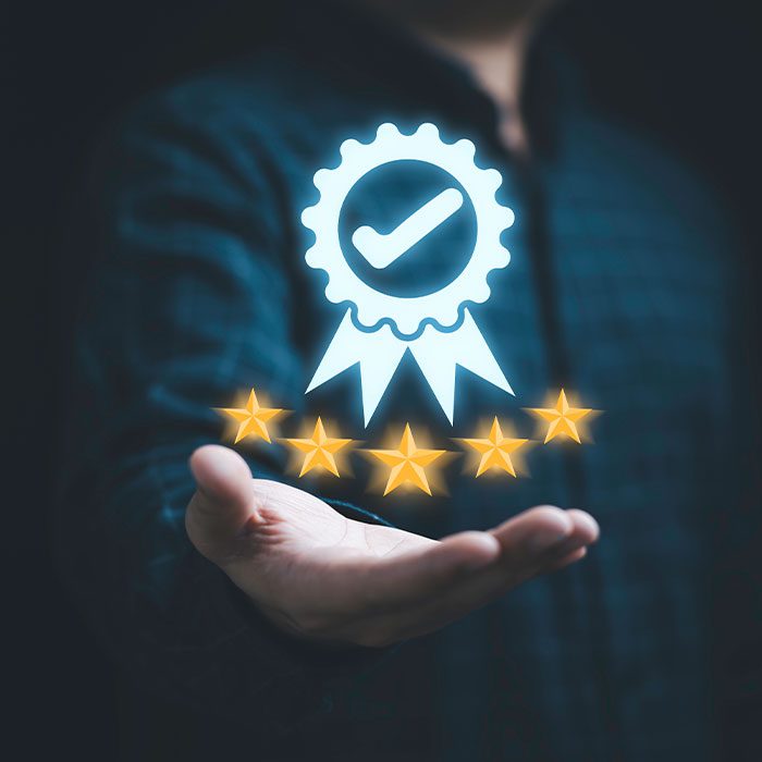 Hand holding an award icon hologram
