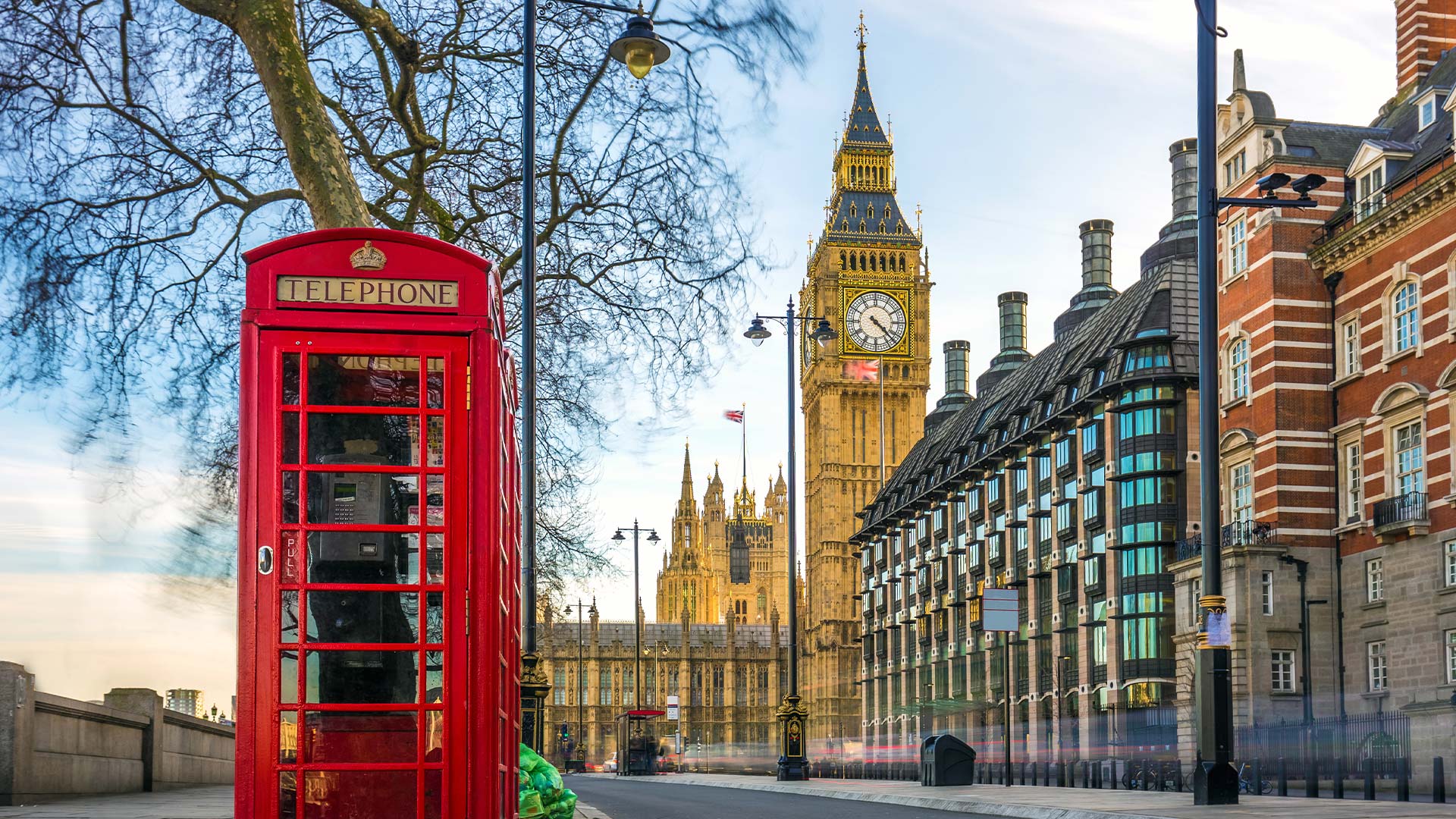 London street with buildings and red post box in view