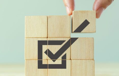 Wooden blocks and a ticked box