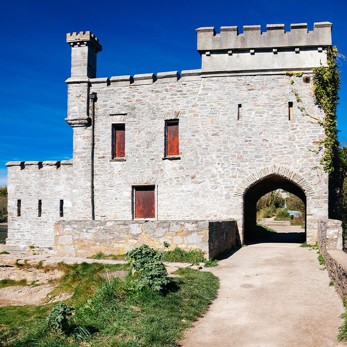 The 19th-century folly known as Radford Castle located on a dam separating the freshwater Radford Lake Plymstock Plymouth Devon England UK