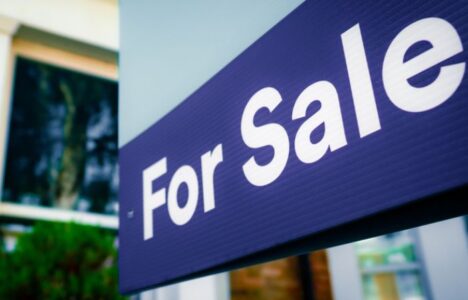 For sale sign outside of house