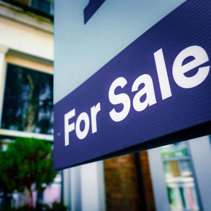 For sale sign outside of house