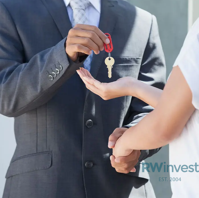 symbolic representation of transferring ownership through property investment