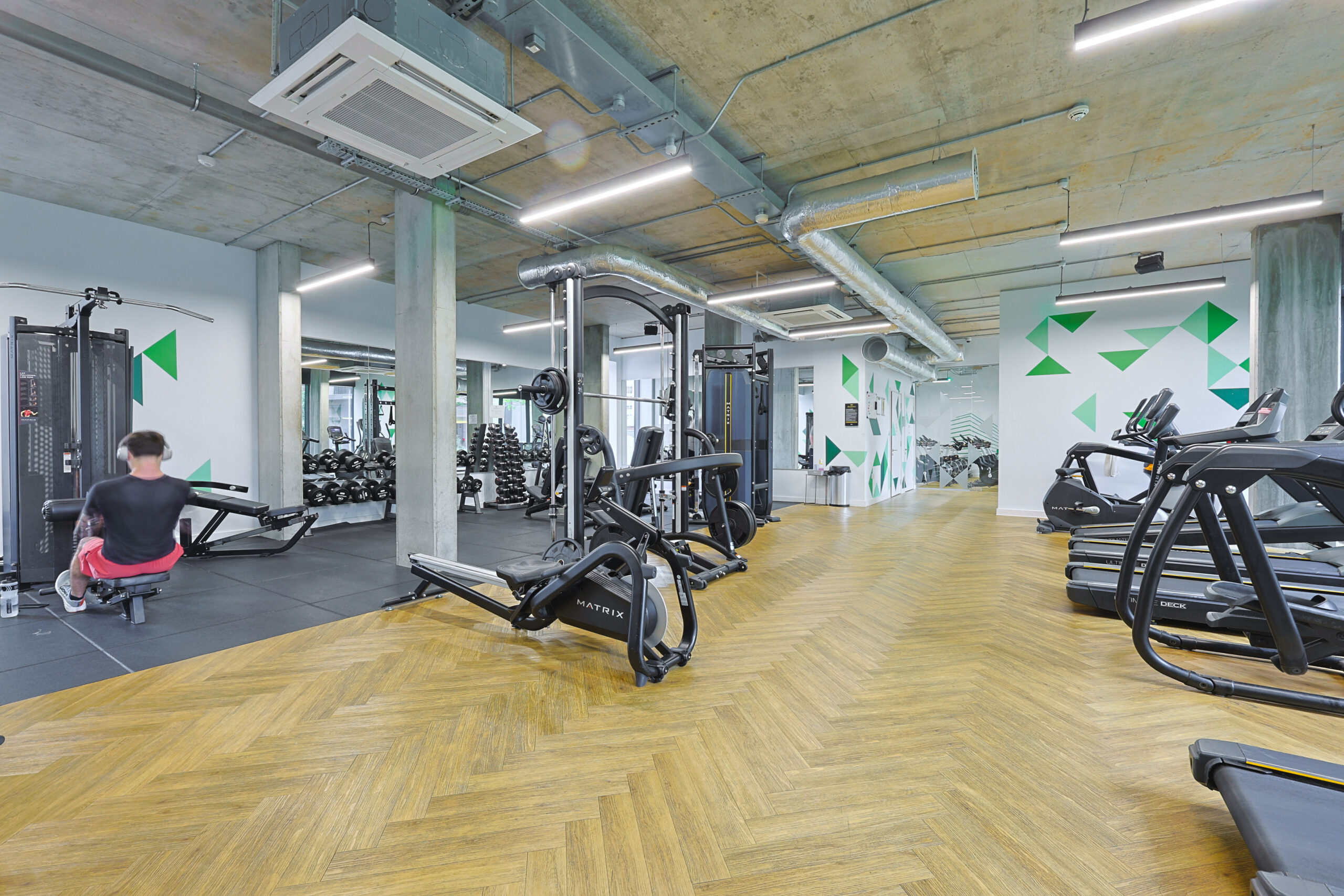 Onsite Gym in Local Blackfriars Manchester Development, With Wooden Flooring, Mirrors and Exercise Equipment