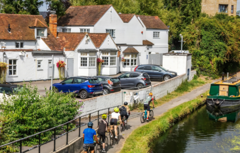 Uxbridge canal in London with houses and greenery beside it
