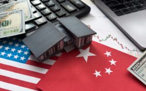 Trumo Trade War - US and China flag with house figure and calculator