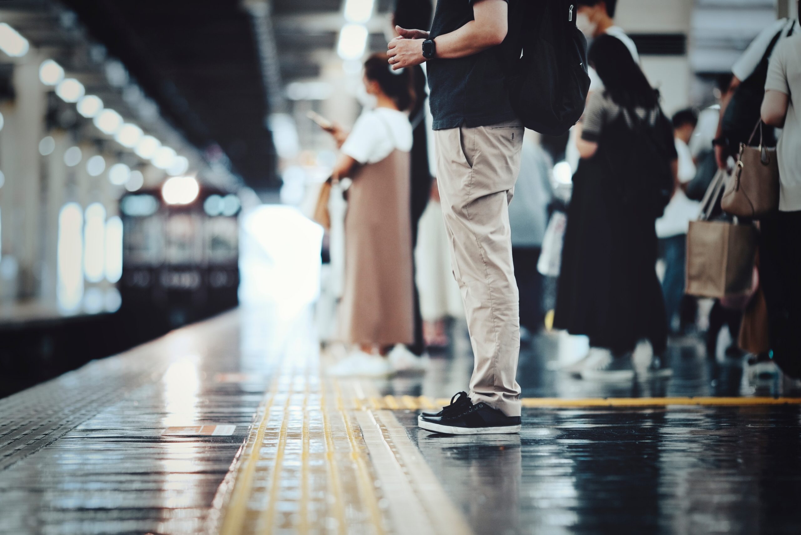 Image showing commuters waiting on train platform about to board train