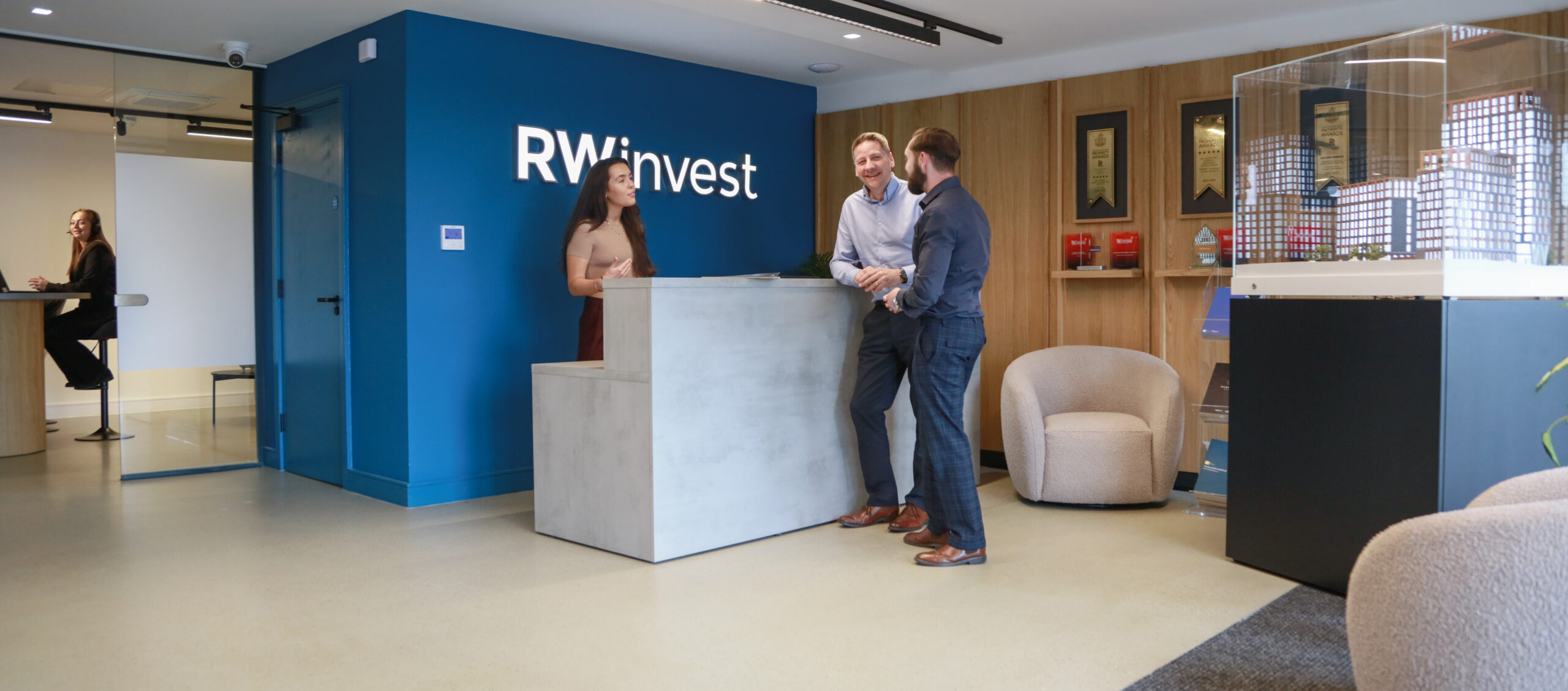 RWinvest Liverpool office showing staff talking at the front desk