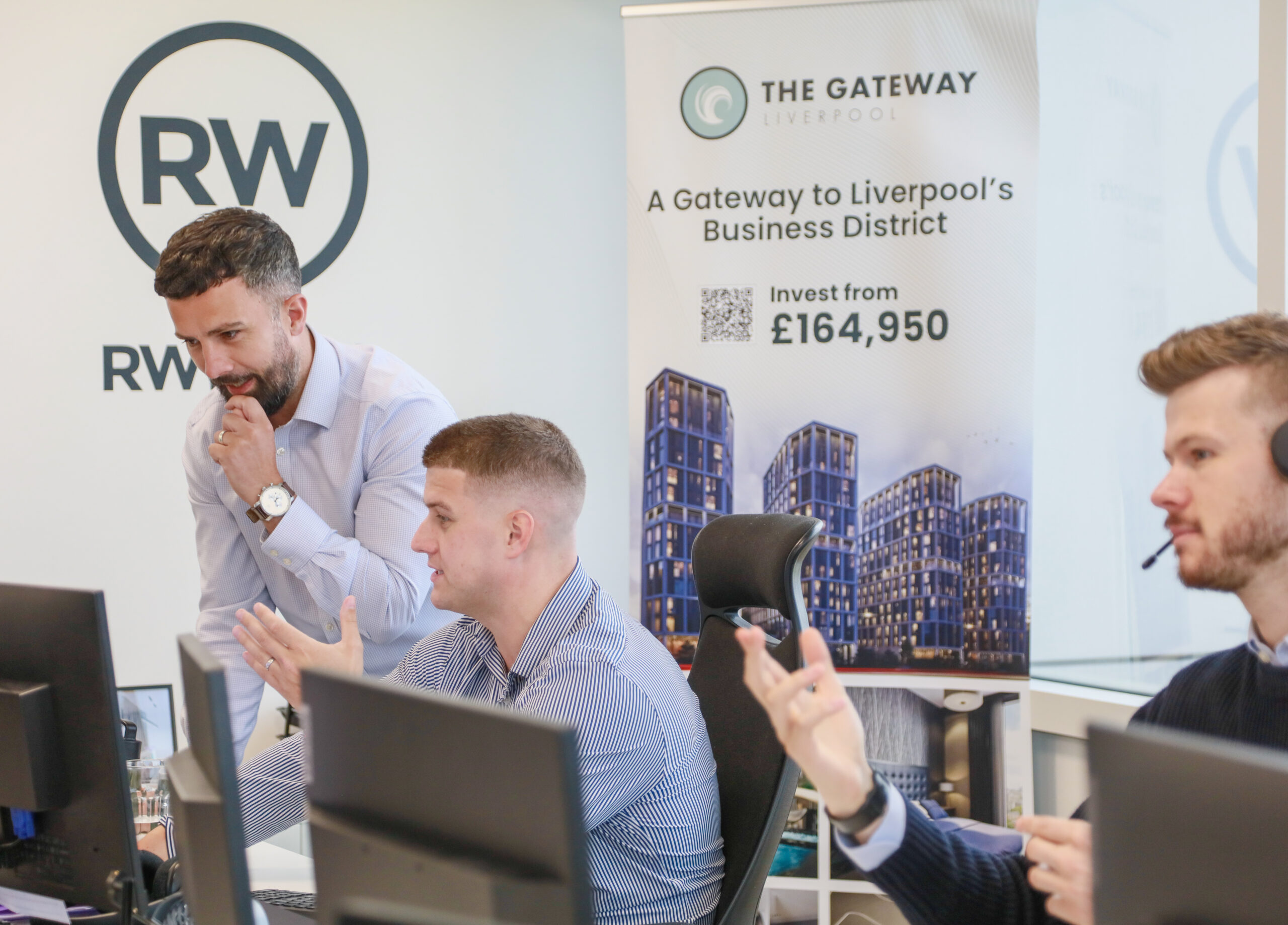 RWinvest Manchester Office with staff working and talking