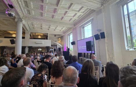 Liverpool Developers Forum 2025 - photo of crowd of people sitting and presenter