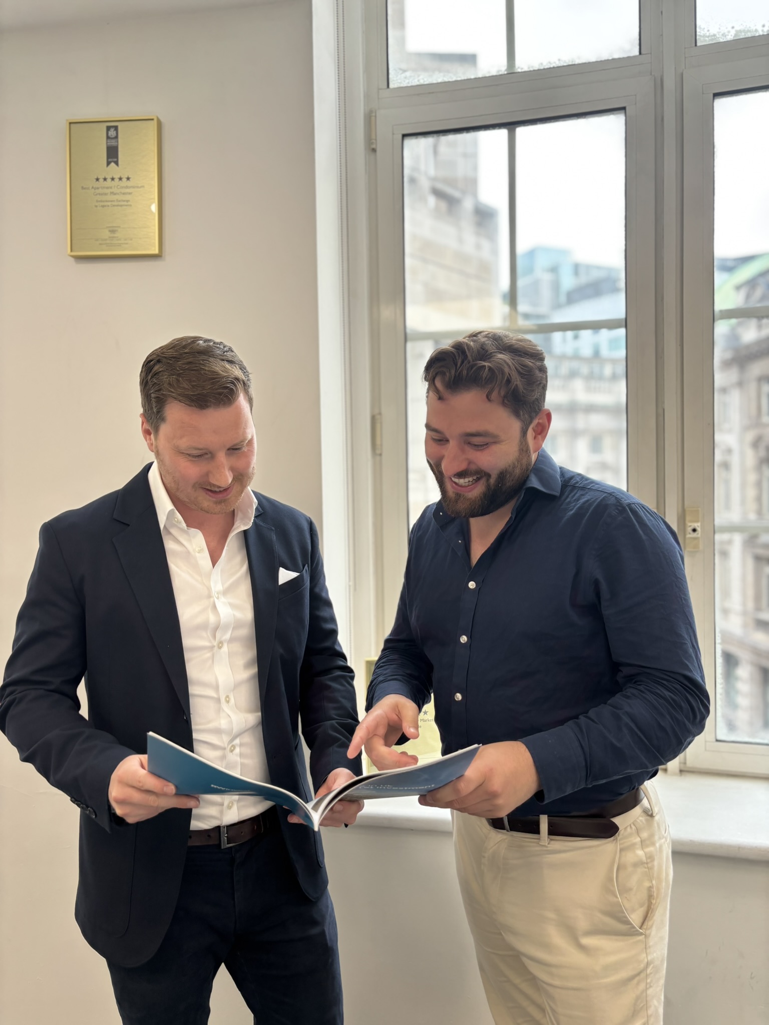 RWinvest sales team members talking in office