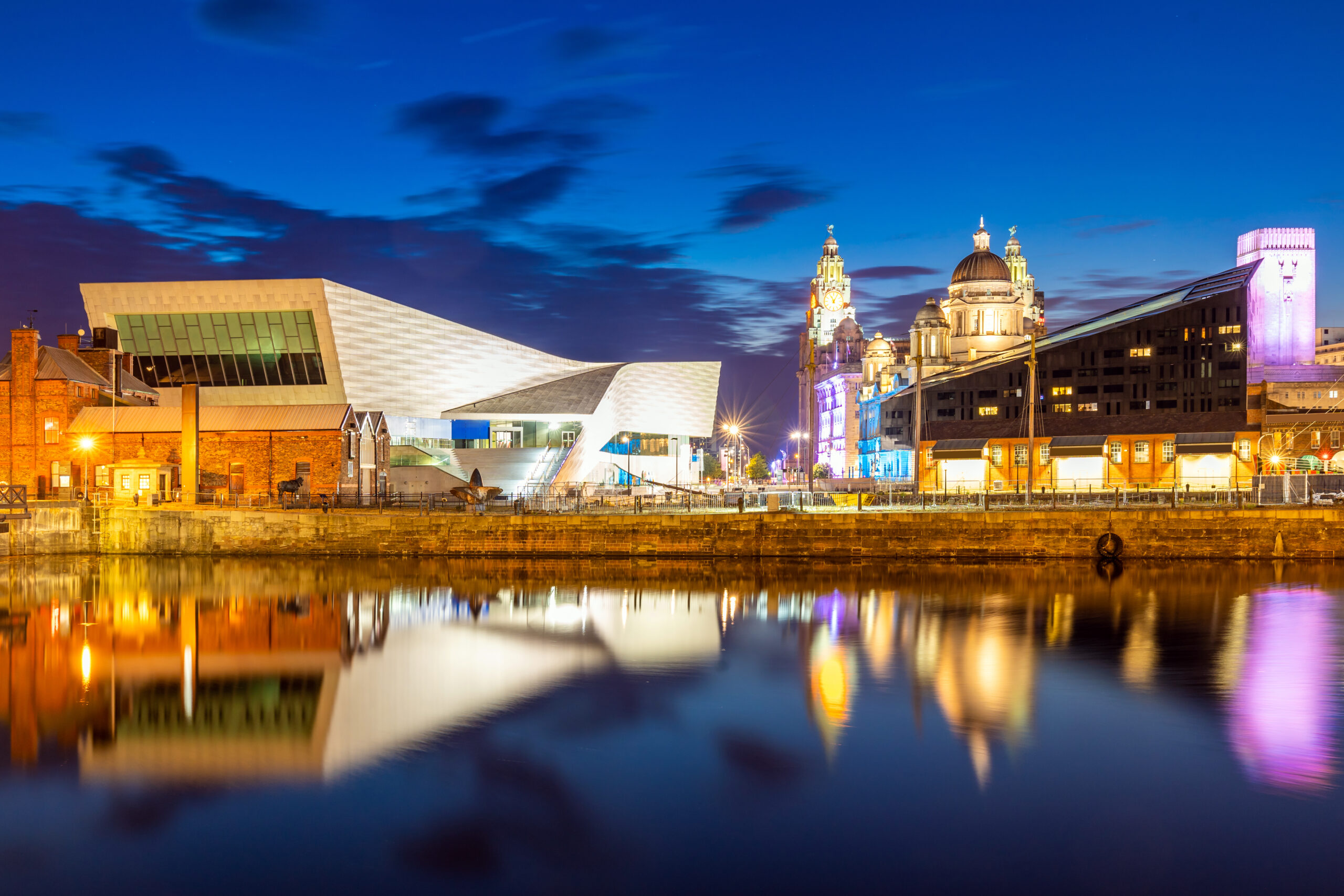 Museum of Liverpool next to Liverpool Three Graces, at nighttime
