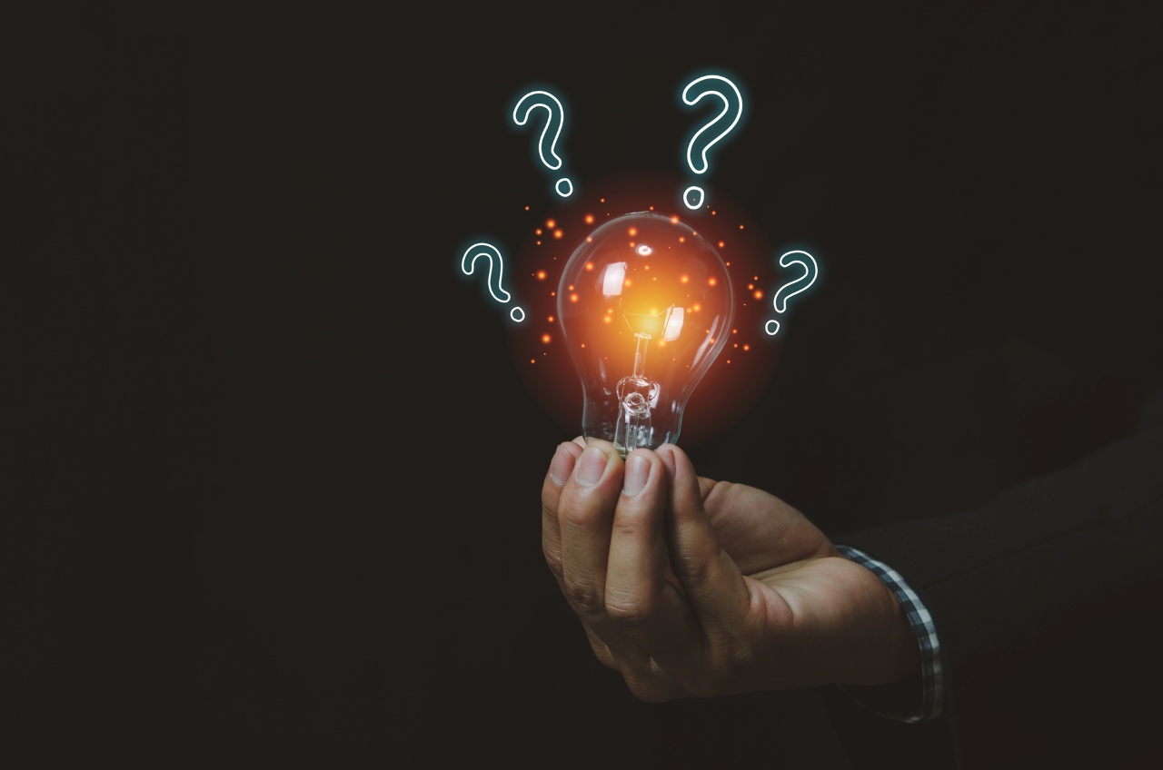 man holding a light bulb with question mark