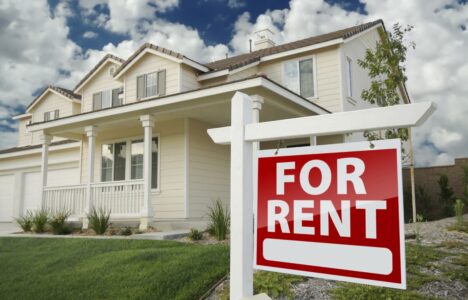 for rent sign post outside a beautiful property