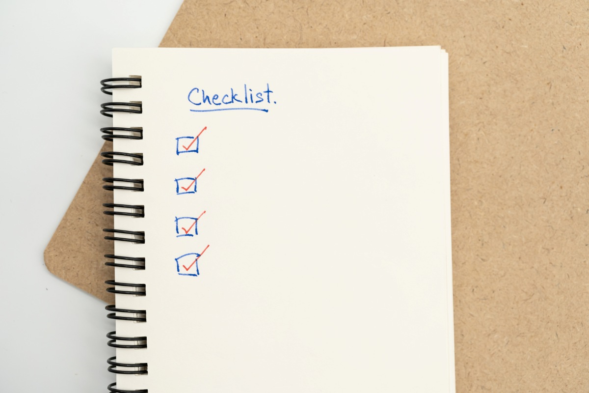 Top view of notebook with handwritten Checklist text