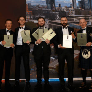 RWinvest team on stage with awards at International Property Awards