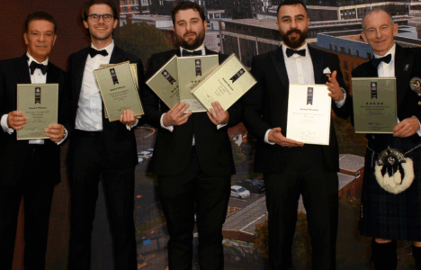 RWinvest team on stage with awards at International Property Awards