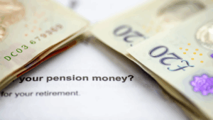 Money on top of paperwork displaying text about pension money